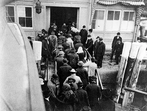 New Immigrants Landing at Battery Park after taking Ferry from Ellis Island.