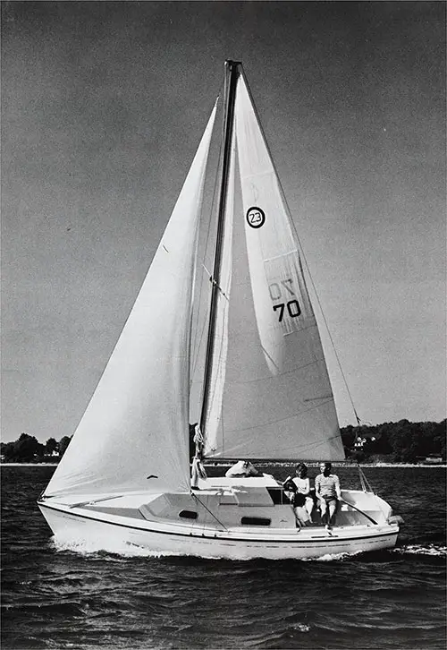 A Couple Enjoys an Outing on the New 1971 O'Day 23. Manufactured by O'Day, A Bangor Punta Company.