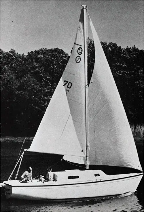A Young Family Enjoys Sailing in Their New 1971 O'Day 23 Sailboat. Manufactured by O'Day, a Bangor Punta Company.