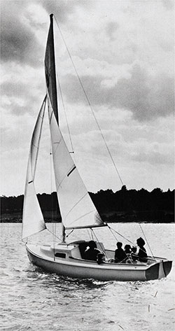 A Family Sails in a New 1971 O'Day Mariner 2+2 Sailboat Near the Shoreline.