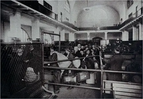 Immigrants FIling Past the Doctors at Ellis Island.