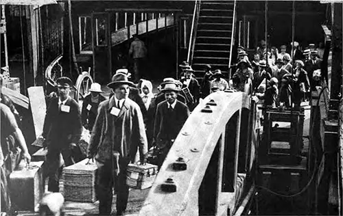 Immigrants Disembarking from the Ferry That has Brought Them from Ellis Island to the Barge Office at the Battery.