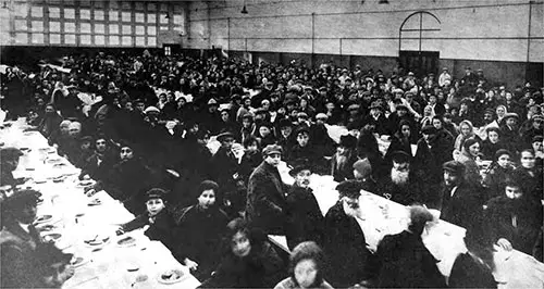 Immigrants at Meal Time at the Old Mess Hall at Ellis Island.