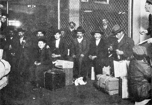 Group of Italian Immigrants Lunching in the Old Railroad Waiting Room at Ellis Island.