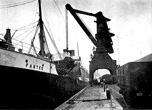 Powerful Hoisting Crane Putting Coal in Steamship.
