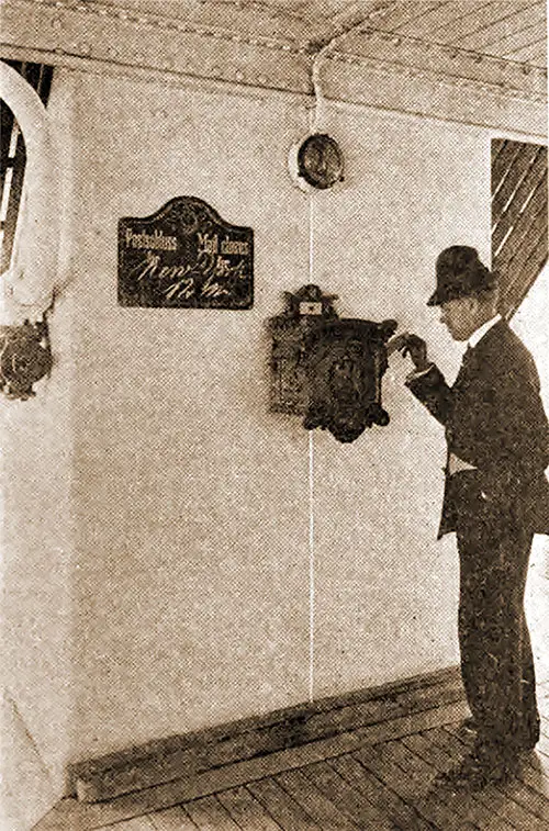 A Passenger Mails a Letter at Sea, Dropping His Mail Into a Collection Box Onboard the Ship.