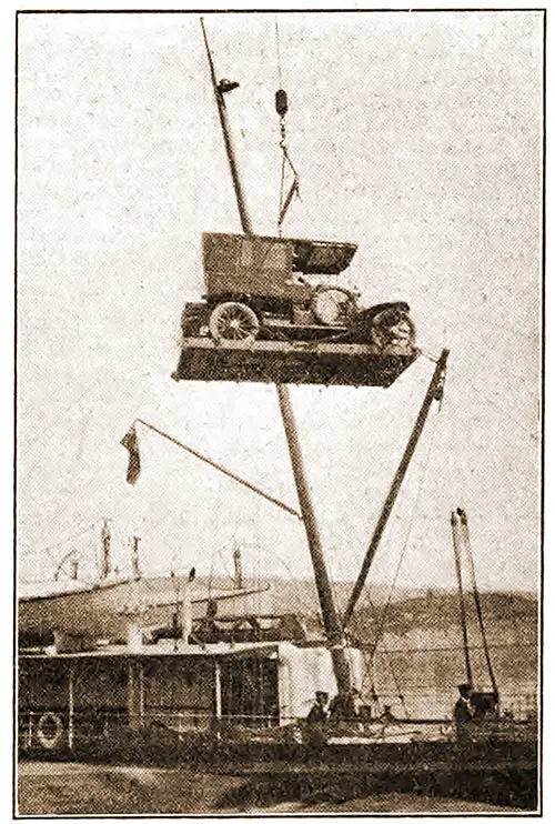 Swinging a Touring Car On Board a Steamship at Folkestone, England.