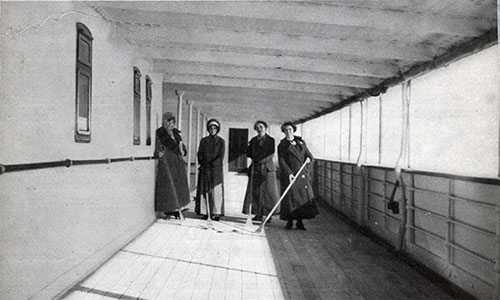 Second Class Passengers Enjoy a Game of Shuffleboard on a Covered Promenade Deck