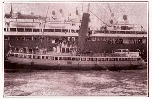 Passenger Tender Pulling Up Alongside an Ocean Liner Anchored in Fishguard Harbor.