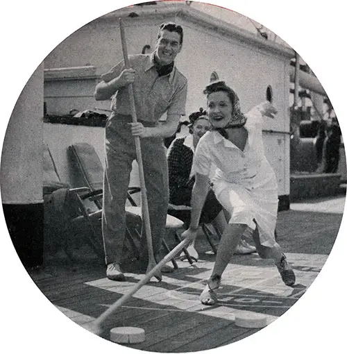 Young Couple of Passengers Play Suffleboard on the Tourist Class Decks.