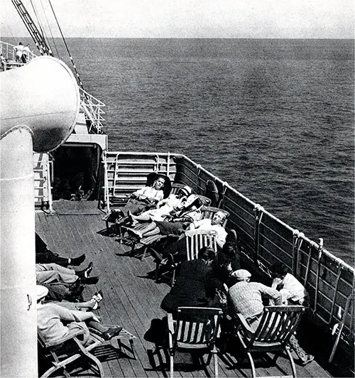 Passengers Relaxing on Deck -- When You Cross the Sea You Leave Worries Behind.