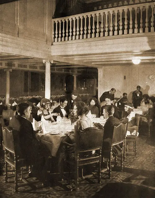 First Class Passengers Enjoy Service at Small Tables.