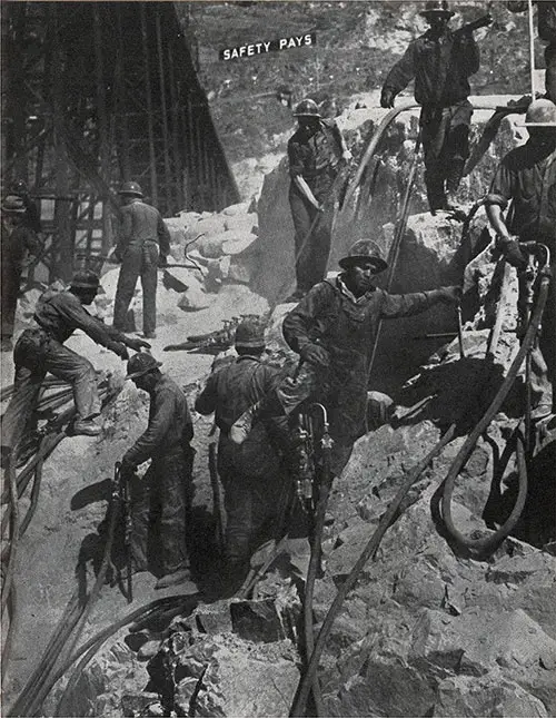 Men and Rock at Grand Coulee. Sign in Background Reads "Safety Pays."