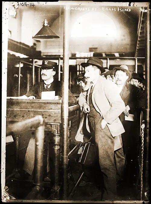 Immigrant at Registration Desk at Ellis Island ca 1910s. Bain News Service.