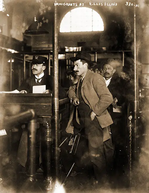 Immigrant at Registration Desk at Ellis Island ca 1910s. Bain News Service.