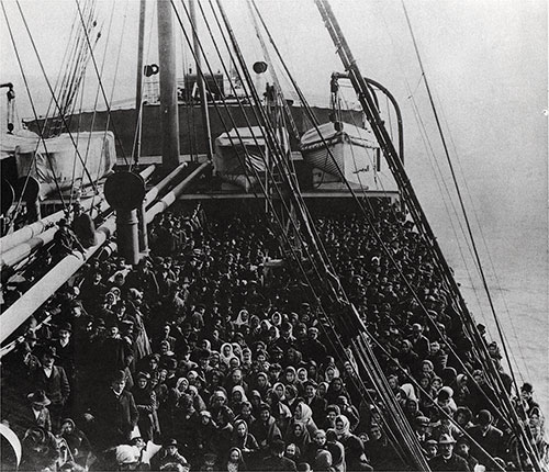 Immigrants in Steerage Crowd the Deck of the SS Patricia as it Sails into the New York Harbor 10 December 1906.