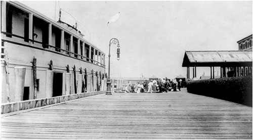 Dock at Ellis Island with Immigrants in the Background. nd circa 1910s.