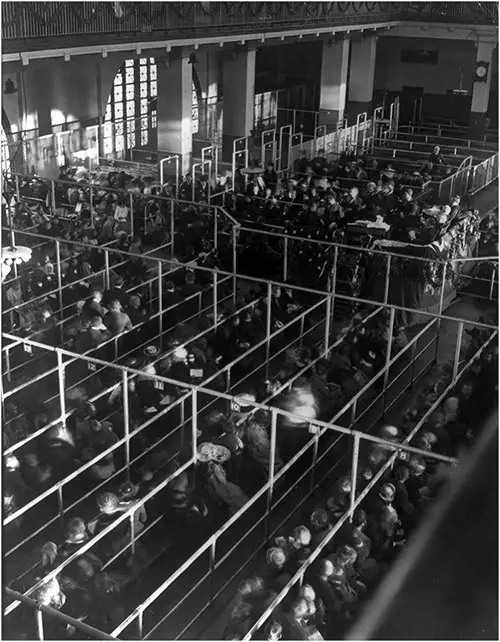 Emigrants in "Pens" at Ellis Island, New York, Probably On or Near Christmas (Note the Decorations).