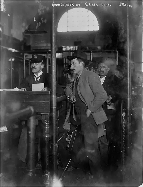 Immigrant at Registration Desk at Ellis Island ca 1910s. Bain News Service.