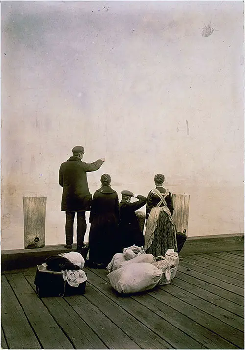 Immigrant Family and their Belongings on a Dock at Ellis Island.
