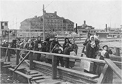 GGA Image ID # 148396ba43 Tender Brings New Immigrants to Landing at Ellis Island.