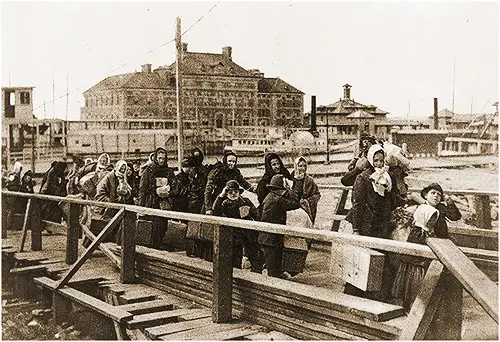 Tender Brings New Immigrants to Landing at Ellis Island.