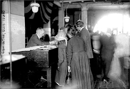 Ellis Island Inspector Examines Immigrant Family's Documents in the Registry Room Circa 1915.