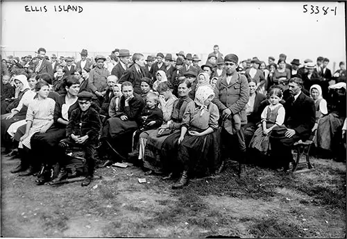 Large Group of Immigrants Gathered Around the Lawn of Ellis Island circa 1910.