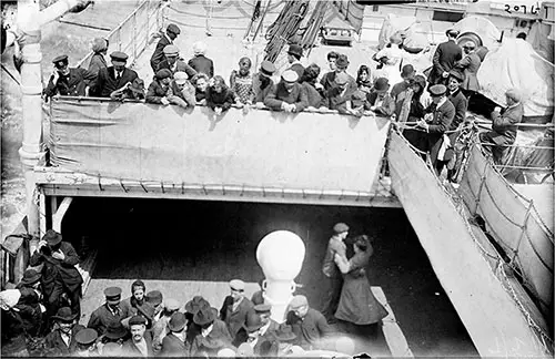 Steerage Passengers Dancing on Lower Level of the Kaiserin Auguste Victoria while Second Class Passengers Look On.