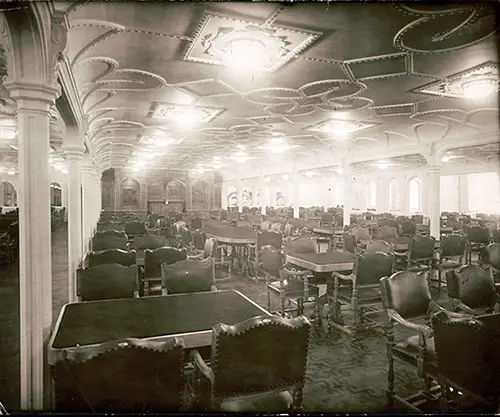 Photograph of the main dining room on the salon deck of the ill-fated White Star Liner Titanic, which foundered in mid-ocean after ramming an iceberg.