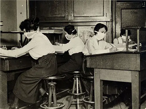 Girls Clerks in New York Work Wearing Protective Masks Against Influenza Epidemic, Carefully Tied About Their Faces.