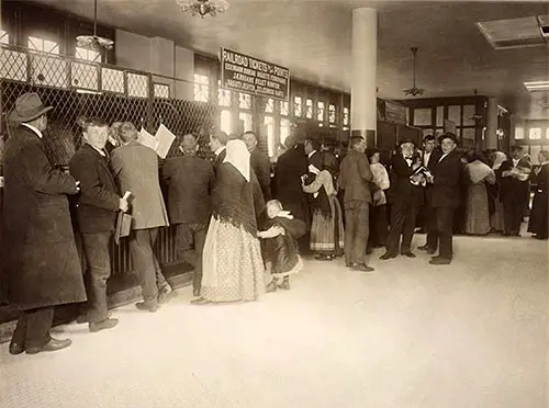 Immigrants Buying Railroad Tickets at Ellis Island, nd, circa 1912.