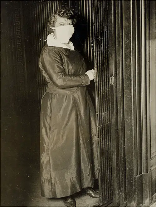 Elevator Operator in New York City Wears Protective Mask During Influenza Epidemic, 16 October 1918.