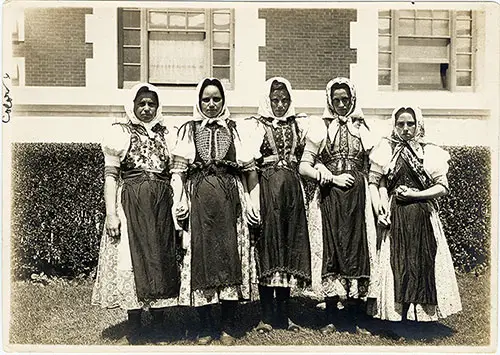 Five Young Female Immigrants in Folk Costumes at Ellis Island. nd.