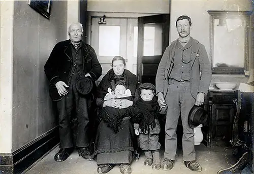 Immigrant Family Photo at Ellis Island - The Parents with Two Young Children and Possibly the Mother's Father.