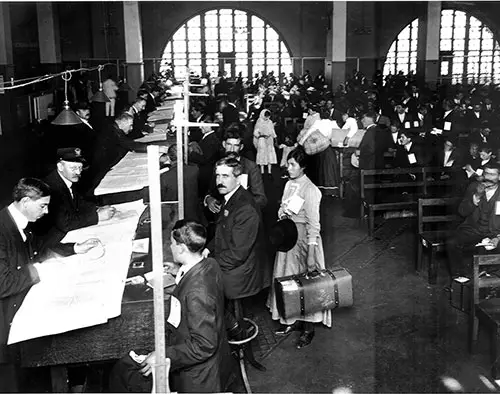 Immigrant Inspection in the Great Hall at Ellis Island, 16 July 1910.