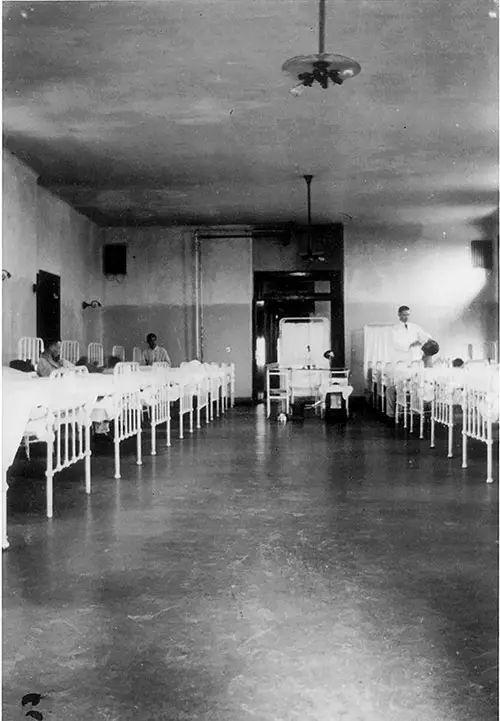 Physicians at Ellis Island Treating Immigrants in the Hospital Ward. nd. circa 1915.