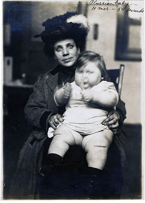 Russian Immigrant Woman with Baby Weighing 55 Pounds at Ellis Island.