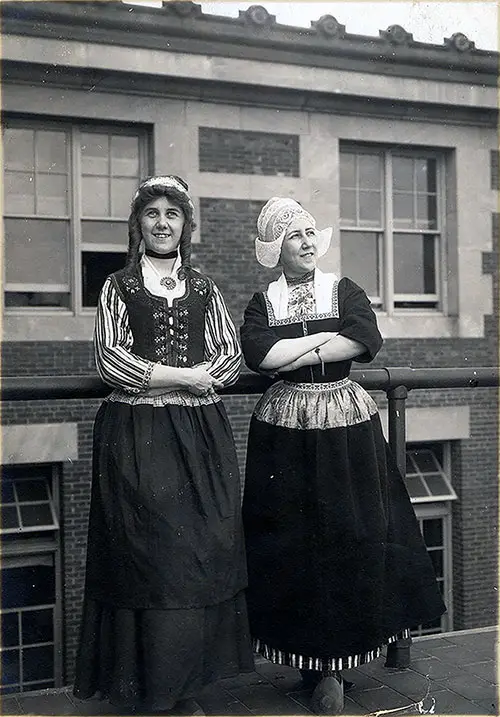 Two Young Ladies in Dutch Folk Costumes from the Netherlands at Ellis Island circa 1910.