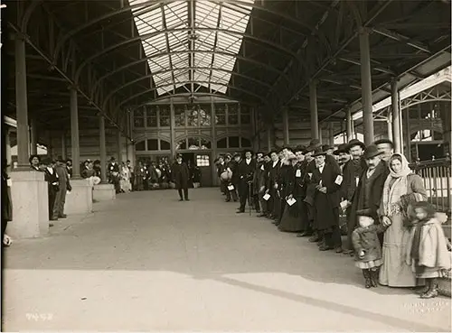 Immigrants Passed and Waiting to Leave Ellis Island on the Next Barge. nd circa 1908