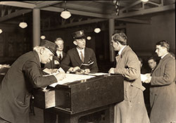 Immigrant Being Questioned Through An Interpreter at Ellis Island