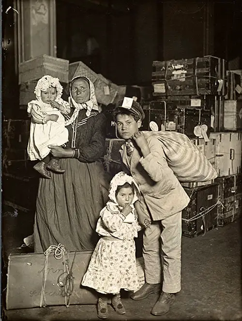Italian Family Looking for Lost Luggage at Ellis Island, 1905.