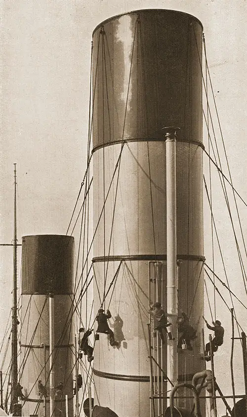 Workmen Are Putting the Familiar Red Paint on Cunard Funnels.