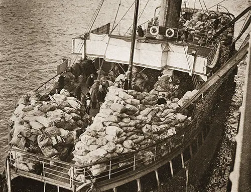 A Large Consignment of Mails Being Landed by Tenders from the Aquitania.