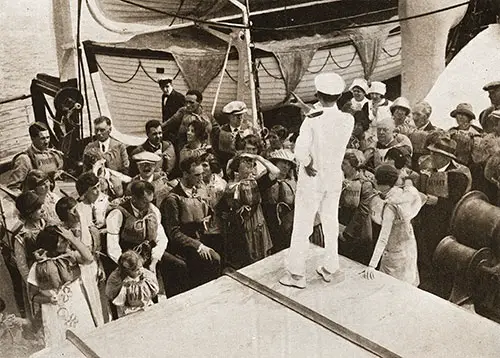 Aquitania Officer Explaining Boat Drill to Passengers with Lifebelts.