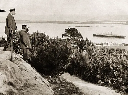 Several People are Watching the SS Auguste Victoria in the Molde Fjord, Møre og Romsdal, Norway.