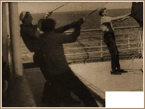 Sailors on the SS Washington Spread Awnings on the Deck.