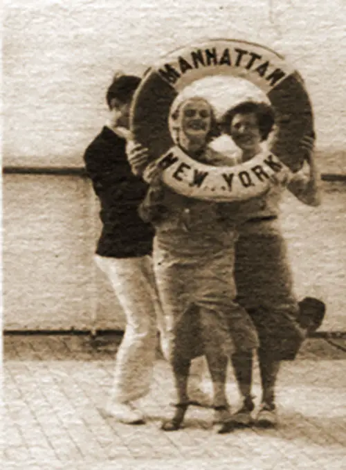 On Each Voyage the Life Preservers Work Overtime as Picture Frames. Passengers Have Their Photo Taken on the Manhattan.