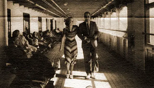 Mr. And Mrs. Curtis and Rebecca Rea Enjoy an Afternoon Stroll on One of the Broad and Airy Promenade Decks of the SS Washington.