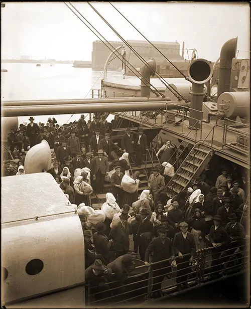 Immigrants on board the North German Lloyd SS Neckar with their belongings preparing to disembark at the immigration station at Pier 9 in the Locust Point area of Baltimore, Maryland. Photo by George R. Luckey, 14 June 1904. 